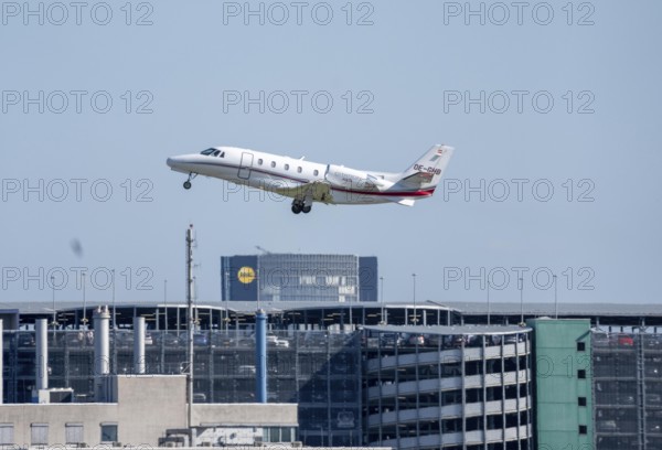 Private jet of the type Cessna Citation XLS, of the Austrian private airline Smartline Luftfahrt, during take-off at Düsseldorf Airport, North Rhine-Westphalia, Germany