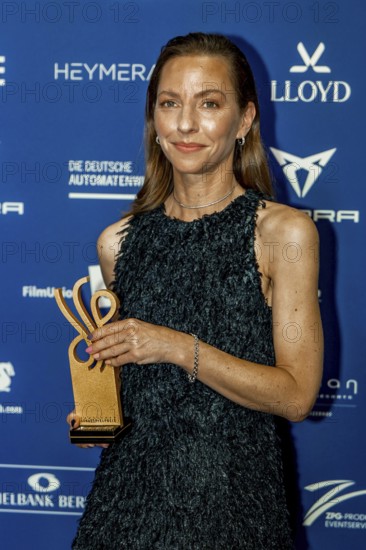 Katharina Schüttler accepts the German Acting Award 2025 for the category Strong Performance in The Cum-Ex Affair on behalf of Lina Beckmann at the award ceremony of the Pullmann Berlin Schweizerhof, Berlin, 09.10.2025