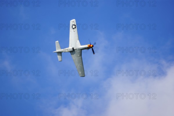 A North American P-51 Mustang of the flying group Flying Bulls, the Nooky Booky IV during an air show at the Rossfeld in Metzingen-Glems, Baden-Württemberg, Germany, for editorial use only