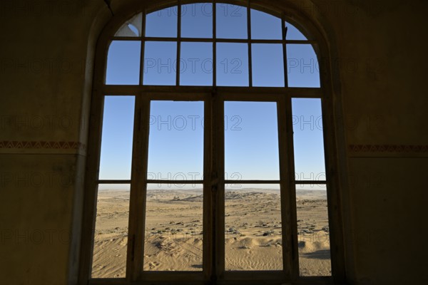 View from a former dwelling house into the desert, Kolmanskop, restricted diamond area, Karas region, Namibia
