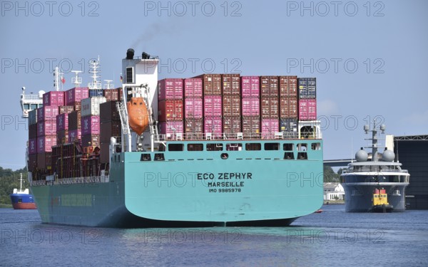 Superyacht COSMOS and container ship ZEPHYR meet in the Kiel Canal, Kiel Canal, Kiel Canal, Schleswig-Holstein, Germany
