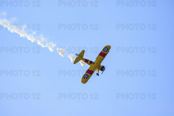 A Boeing-Stearman biplane during a flight demonstration as part of an air show at the Rossfeld in Metzingen-Glems, Baden-Württemberg, Germany, for editorial use only