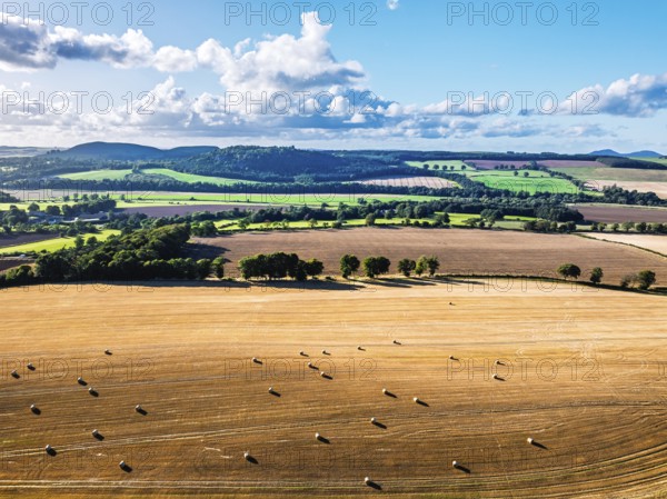 Straw bales in the Scottish fields from a drone, Southeast Scotland, UK