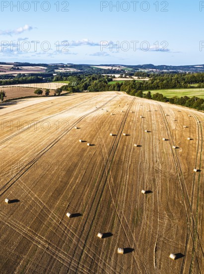 Straw bales in the Scottish fields from a drone, Southeast Scotland, UK