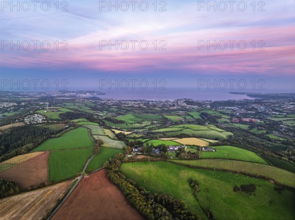 Twilight Sky of Torbay farms and fields from a drone, Totnes, Berry Pomeroy, Devon, England, United Kingdom