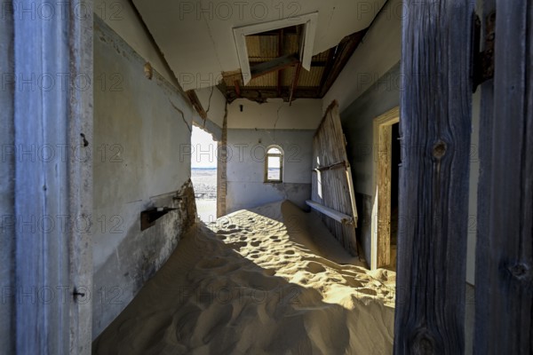 Sand mountains in a former dwelling house, interior photograph, Kolmanskop, restricted diamond area, near Lüderitz, Karas region, Namibia