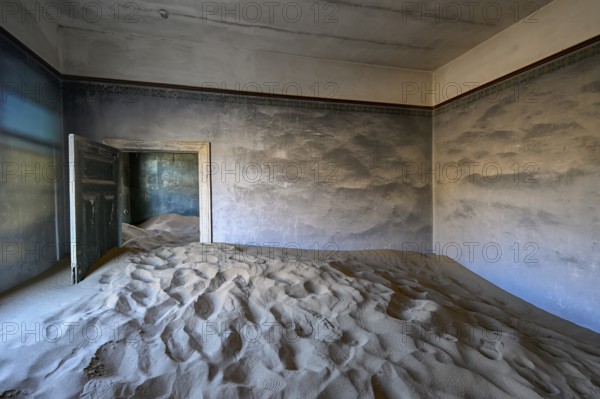 Sand mountains in a former dwelling house, interior photograph, Kolmanskop, restricted diamond area, near Lüderitz, Karas region, Namibia
