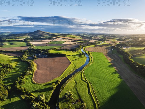 Fields and Farms over River Teviot and Minto Crags from a drone, Roxburghshire, Scottish Borders, Scotland, UK