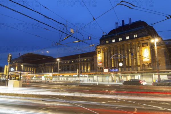 Street and tram tracks in front of the main station, tracers, blue hour, main station, Leipzig, Saxony, Germany