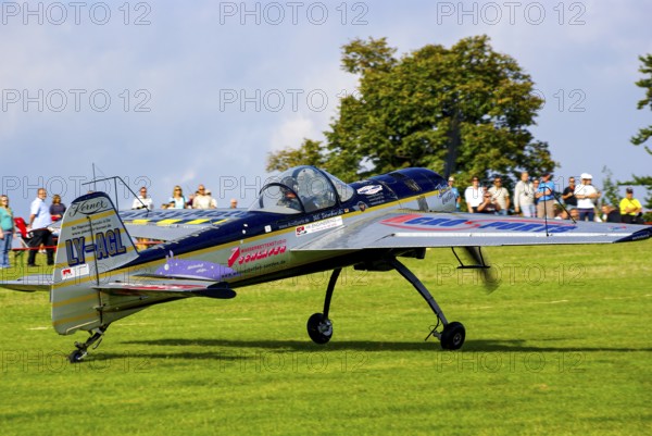 A Jakovlev Jak-55 with the registration LY-AGL during a flight demonstration as part of an air show at the Rossfeld in Metzingen-Glems, Baden-Württemberg, Germany, for editorial use only