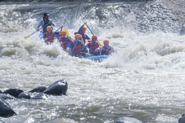 A group of people white water rafting, Costa Rica, Central America