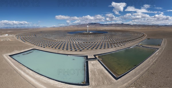 Tonopah, Nevada - The Crescent Dunes Solar Energy Project in the Nevada desert. Ten thousand mirrors reflect sunlight onto a tower where molten salt is heated to produce steam and generate electricity