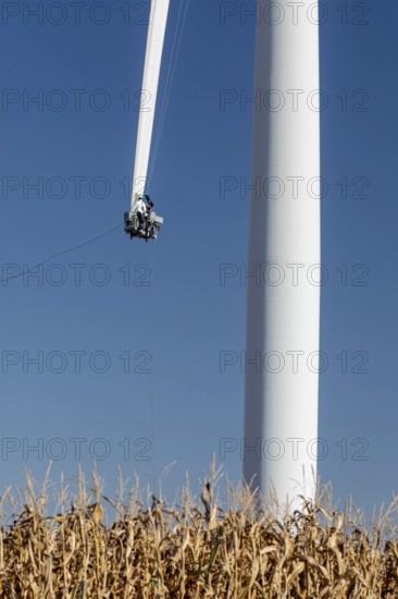 Luverne, Minnesota - Workers repair the cracked blade of a wind turbine