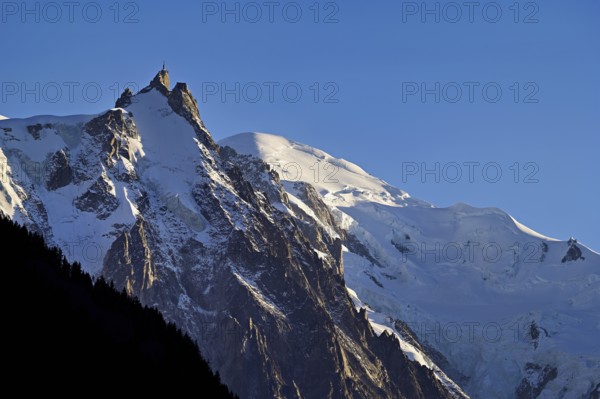 From left snow-covered Aiguille du Midi, Mont-Blanc, Vallot Hut, Chamonix-Mont-Blanc, Haute-Savoie, France