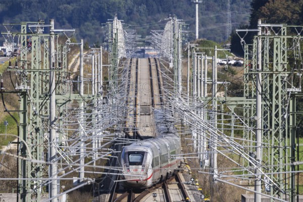 Deutsche Bahn AG high-speed railway line between Stuttgart and Ulm. New railway line with ICE of Deutsche Bahn AG with overhead lines and railway technology. Kirchheim unter Teck, Baden-Württemberg, Germany