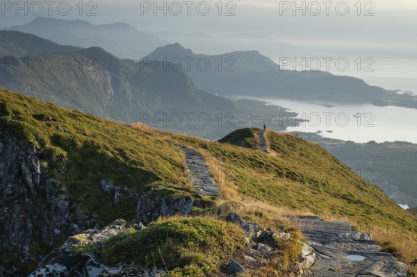 Hikers on Rørsethornet stone staircase, with 3292 steps one of the longest continuous stone staircases in the world, Sherpatreppe or Midsundtreppe or Midsundtrappene, Rørsethornet hike, Otroya or Otrøya island, Møre og Romsdal, Norway