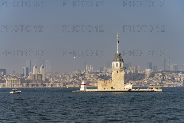 The Maiden Tower lighthouse, Leander Tower or Maiden Tower in front of the skyline of Istanbul, Turkey