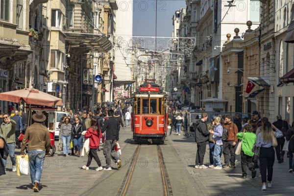 The nostalgic tram on the shopping street Istiklal Caddesi in Beyoglu, Istanbul, Turkey