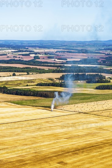 Scottish fields over Waterloo Monument from a drone, Jedburgh, Scotland, UK