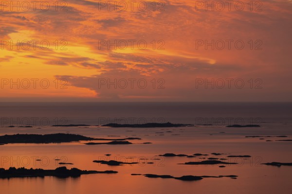 Offshore islands and skerries, sea, dramatically illuminated clouds, sunset, Otroya or Otrøya island, Møre og Romsdal, Norway