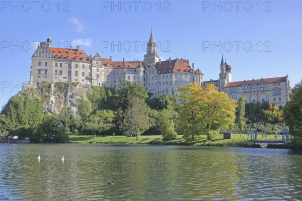 Hohenzollern Castle and Danube, river bank with autumn colours, landmark, castle, Sigmaringen, Swabian Alb, Baden-Württemberg, Germany