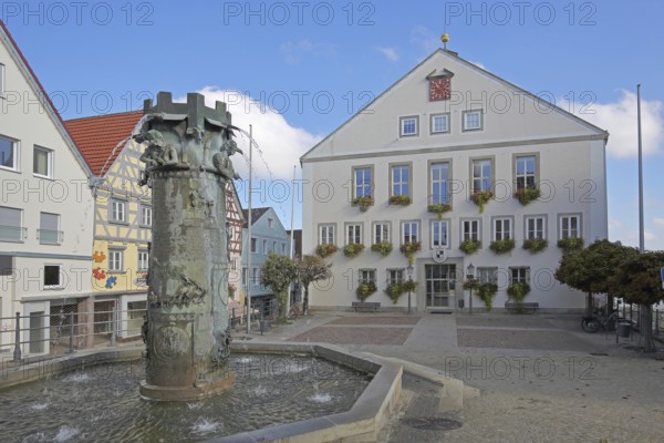 Town hall built in 1958 and town hall fountain with reliefs and figures by Klaus Ringwald 1998, market square, Hechingen, Swabian Alb, Baden-Württemberg, Germany