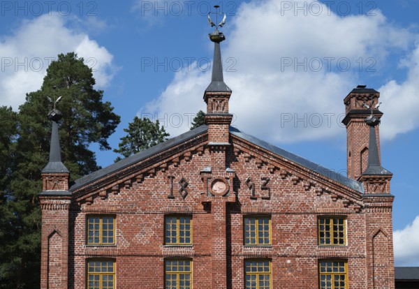 Multi-storey brick façade with inscription 1893, former paper factory and mill for the production of groundwood pulp board, UNESCO World Heritage Site Factory Village Verla, Maailmanperintökohde Verlan puuhiomo ja pahvitehdas, Verla Rapids, Kymenlaakso, near Kouvola, Finland