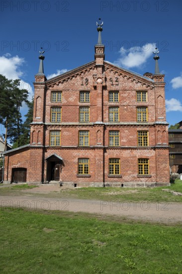 Multi-storey brick façade with inscription 1893, former paper factory and mill for the production of groundwood pulp board, UNESCO World Heritage Site Factory Village Verla, Maailmanperintökohde Verlan puuhiomo ja pahvitehdas, Verla Rapids, Kymenlaakso, near Kouvola, Finland