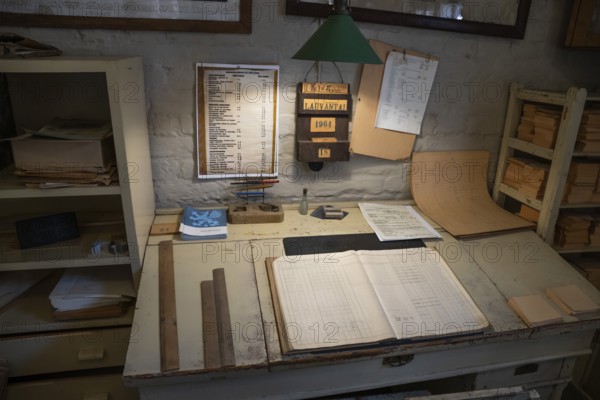 Desk in an office, former paper factory and mill for the production of groundwood pulp board, UNESCO World Heritage Site Verla Factory Village, Maailmanperintökohde Verlan puuhiomo ja pahvitehdas, Verla Rapids, Kymenlaakso, near Kouvola, Finland