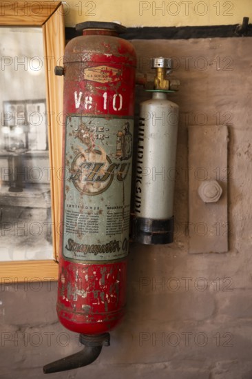 Old, rusty fire extinguisher from the Sisu company, former paper factory and mill for the production of groundwood pulp board, UNESCO World Heritage Site Factory Village Verla, Maailmanperintökohde Verlan puuhiomo ja pahvitehdas, Verla Rapids, Kymenlaakso, near Kouvola, Finland