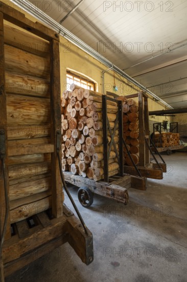 Carts with sawn logs for further processing, former paper factory and mill for the production of groundwood pulp board, UNESCO World Heritage Site Verla Factory Village, Maailmanperintökohde Verlan puuhiomo ja pahvitehdas, Verla Rapids, Kymenlaakso, near Kouvola, Finland