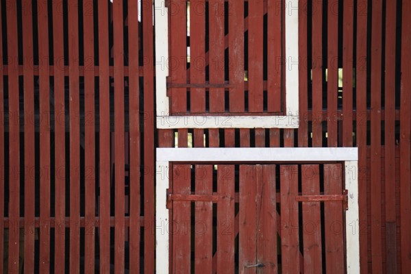 Falun red painted wooden slats of a barn, former paper factory and mill for the production of groundwood pulp board, UNESCO World Heritage Site Factory Village Verla, Maailmanperintökohde Verlan puuhiomo ja pahvitehdas, Verla Rapids, Kymenlaakso, near Kouvola, Finland