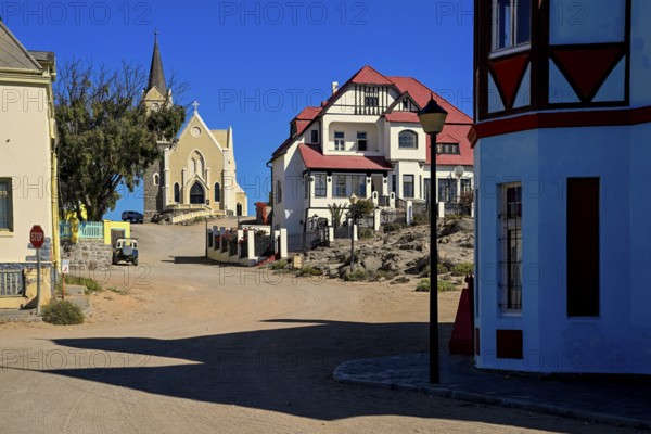 Colonial house facade in the Bergstraße, in the background the rock church, Lüderitz, Karas region, Namibia