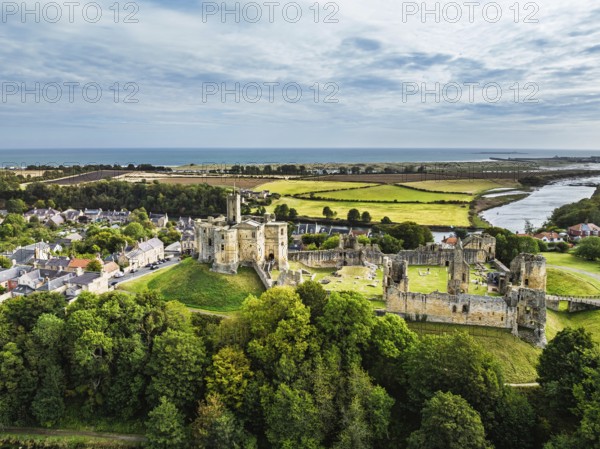 Warkworth Castle over River Coquet from a drone, Warkworth, Northumberland, England, United Kingdom