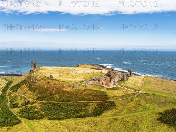 Dunstanburgh Castle from a drone, Northumberland Coast, England, United Kingdom