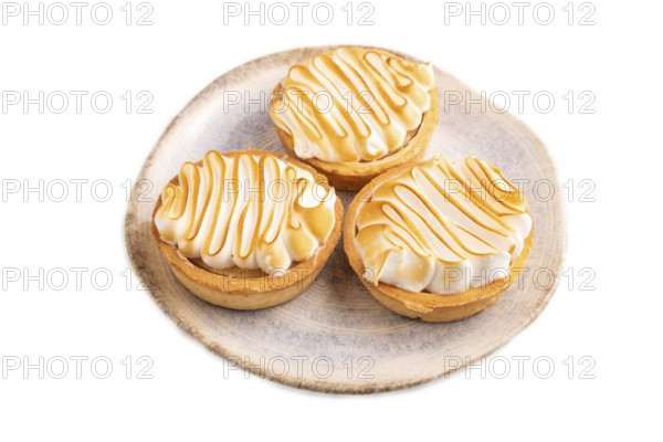 French lemon tart with meringue isolated on white background, side view, close up