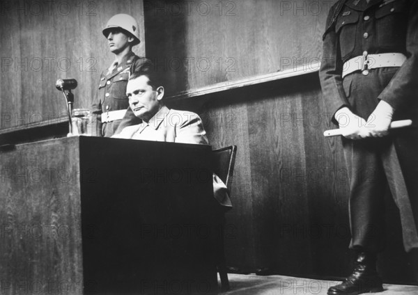Nuremberg Trials, main war criminals, unusual perspective, only existing photograph taken in the courtroom, Nuremberg 1946 J. Chaldej: I wanted to photograph Göring in the courtroom from an unusual perspective. That was forbidden. I got in touch with the secretary of the Soviet judge Nikitenko. I swapped places with him for a few hours in exchange for a bottle of gin and was able to take this photo