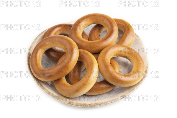 Homemade Ring Bagel isolated on white background. side view, close up