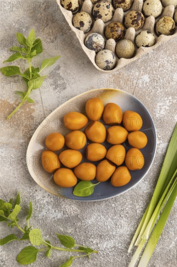 Organic non dairy banana and soy milk in clay cup on brown wooden background. Vegan healthy food concept, flat lay, side view, copy space