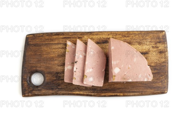 Mortadella sausage on wooden cutting board with pepper and herbs isolated on white background. Top view, flat lay, close up