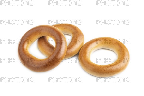 Homemade Ring Bagel isolated on white background. side view, close up