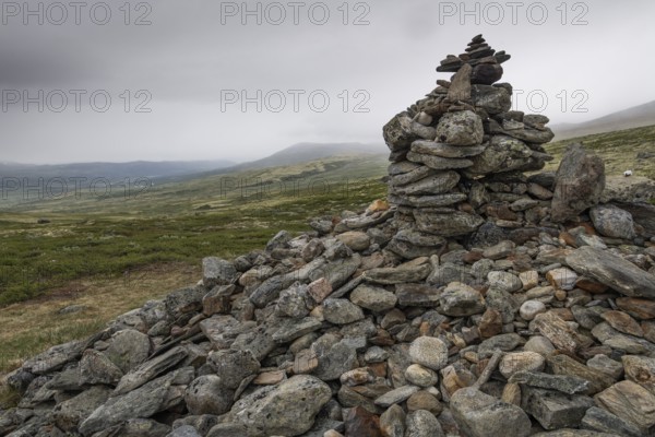 Stones deposited by pilgrims, stone pyramid, Allmannrøysa, Olav's Way or Olavsleden, old Kongevegen or King's Path over Dovrefjell, Norway