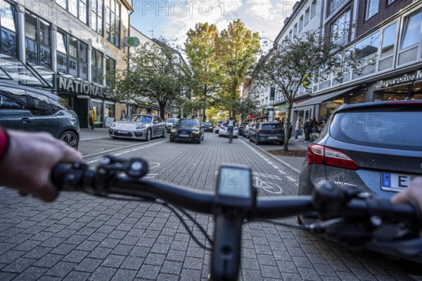 Cycling in the city, city centre road, cycle lane, two-wheeled traffic has priority, 30 km/h zone, cyclists' perspective, Essen, North Rhine-Westphalia, Germany