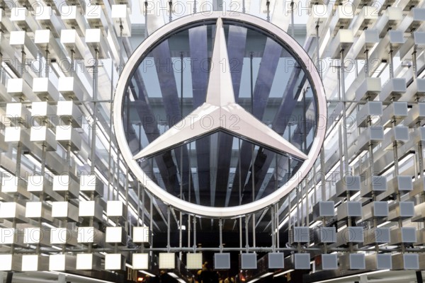 Munich, Germany - 10.9.2025: A large Mercedes star, logo of the German car manufacturer Mercedes-Benz, stands at the entrance to the Mercedes-Benz stand during the IAA Open Space at the IAA Mobility 2025 (International Motor Show) in Munich