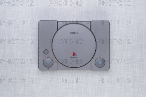 Top shot of a Playstation 1 on a white Resopal board