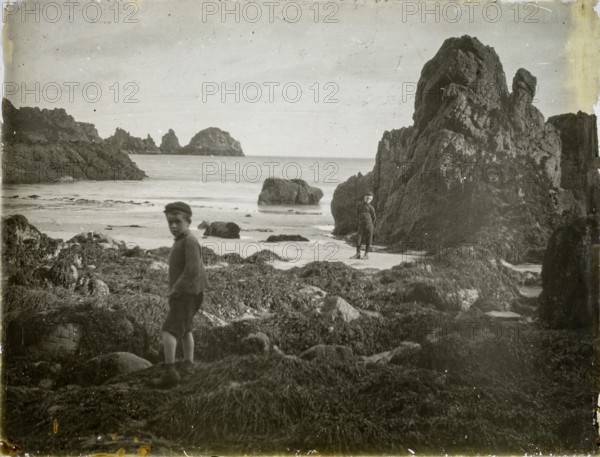 Magic lantern slide two boys playing on rocky beach circa 1900, Moulin Huet Bay, Guernsey, Channel Islands