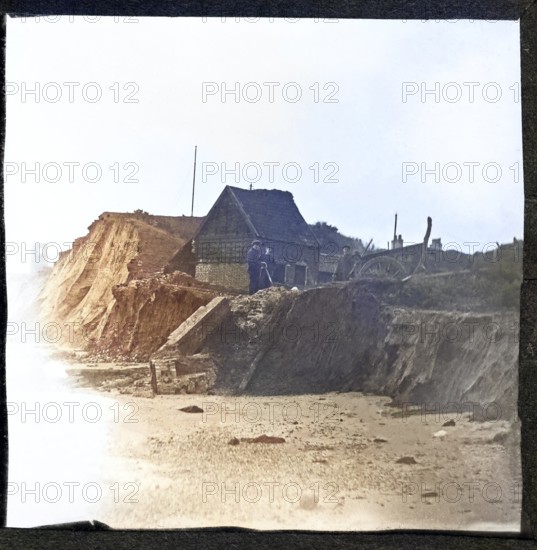 Colorised magic lantern slide of coastal erosion at village of Dunwich, Suffolk, England, UK c 1900