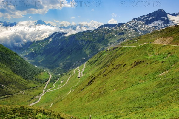 View to the left in the background at the lower cloud line Grimselpass, in front mountain pass alpine pass alpine mountain road alpine road road pass pass road pass on Furka Furkapass above above tree line in Swiss Alps High Alps, Andermatt, Canton Uri, Gletsch, Canton Valais, Switzerland