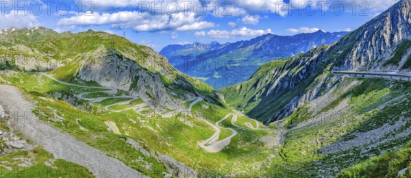 Panoramic view photo on miite left Tremola southern historic ascent from Airolo to Gotthard Pass, centre right at the edge of the picture avalanche protection roofing of modern pass road to northern descent to Hospental, Canton Uri, Switzerland