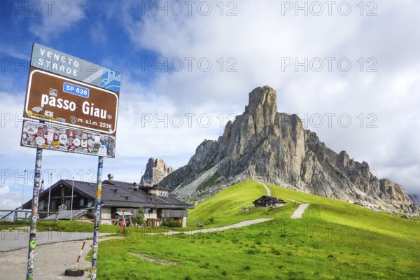 Sign at the top of the Alpine pass road Passo Giau, on the right summit of Monte Gusela Ra Gusela, province of Belluno, Veneto, Italy